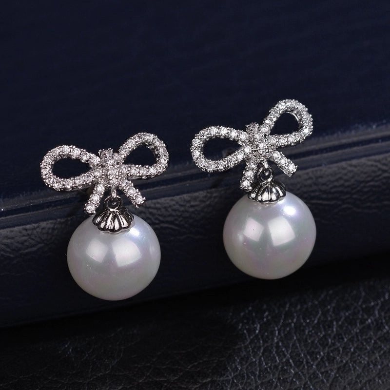 1 Pair Elegant Bow Knot Inlay Copper Alloy Artificial Pearls Zircon White Gold Plated Drop Earrings