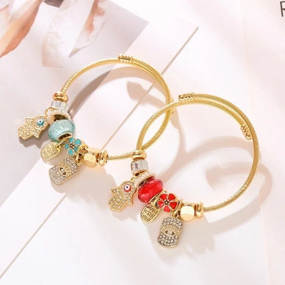 Elegant Devil'S Eye Palm 304 Stainless Steel Alloy Gold Plated Rhinestones Bangle In Bulk