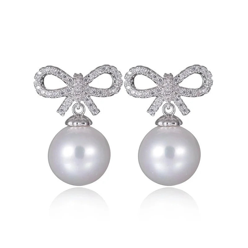 1 Pair Elegant Bow Knot Inlay Copper Alloy Artificial Pearls Zircon White Gold Plated Drop Earrings