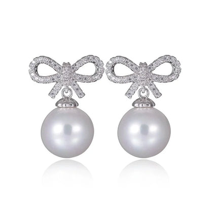 1 Pair Elegant Bow Knot Inlay Copper Alloy Artificial Pearls Zircon White Gold Plated Drop Earrings