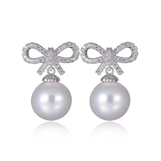 1 Pair Elegant Bow Knot Inlay Copper Alloy Artificial Pearls Zircon White Gold Plated Drop Earrings