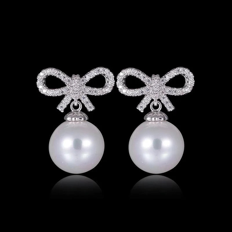 1 Pair Elegant Bow Knot Inlay Copper Alloy Artificial Pearls Zircon White Gold Plated Drop Earrings