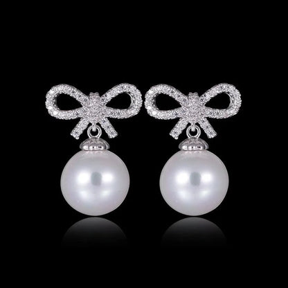 1 Pair Elegant Bow Knot Inlay Copper Alloy Artificial Pearls Zircon White Gold Plated Drop Earrings