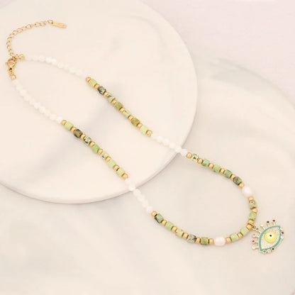 Vacation Bohemian Devil'S Eye Heart Shape Artificial Pearl Natural Stone Copper 18K Gold Plated Zircon Pendant Necklace In Bulk